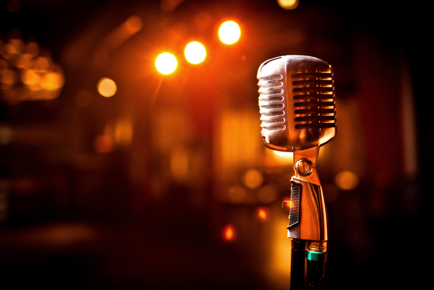 Microphone knowledge is important when learning how to become a backup singer on stage